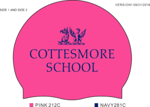 A bright pink swimming cap with cottesmore school in navy blue written on it with a dragon and a griffen head as the emblem above the writing