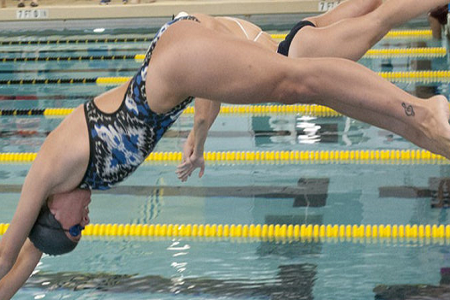 A swimmer diving in